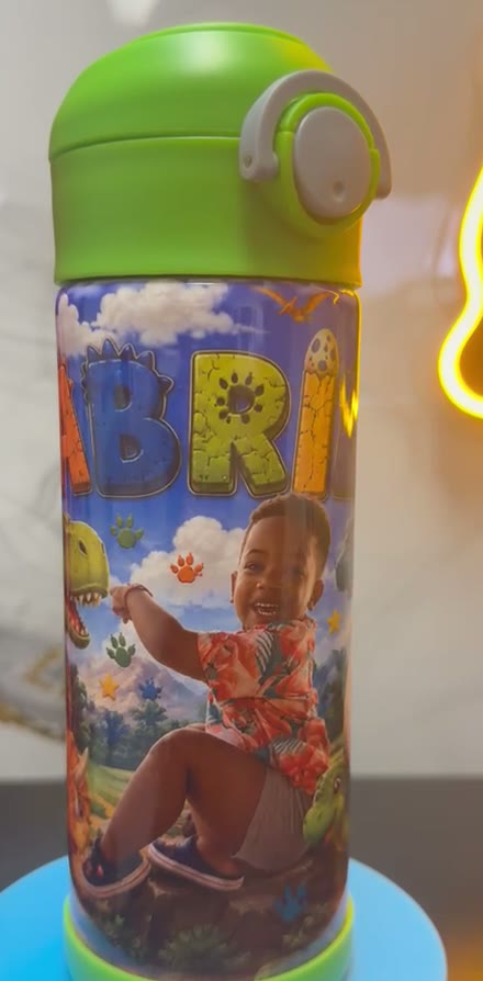 Termo infantil personalizado con dinosaurios y la foto de un niño